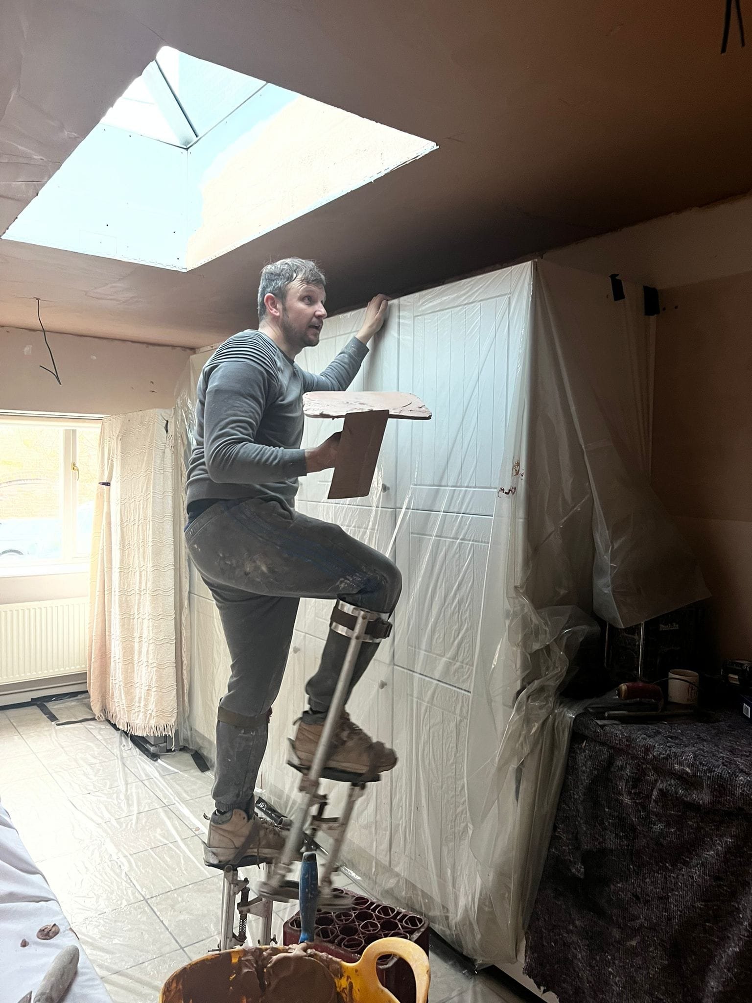 Plasterers in Telford working on a plastering job